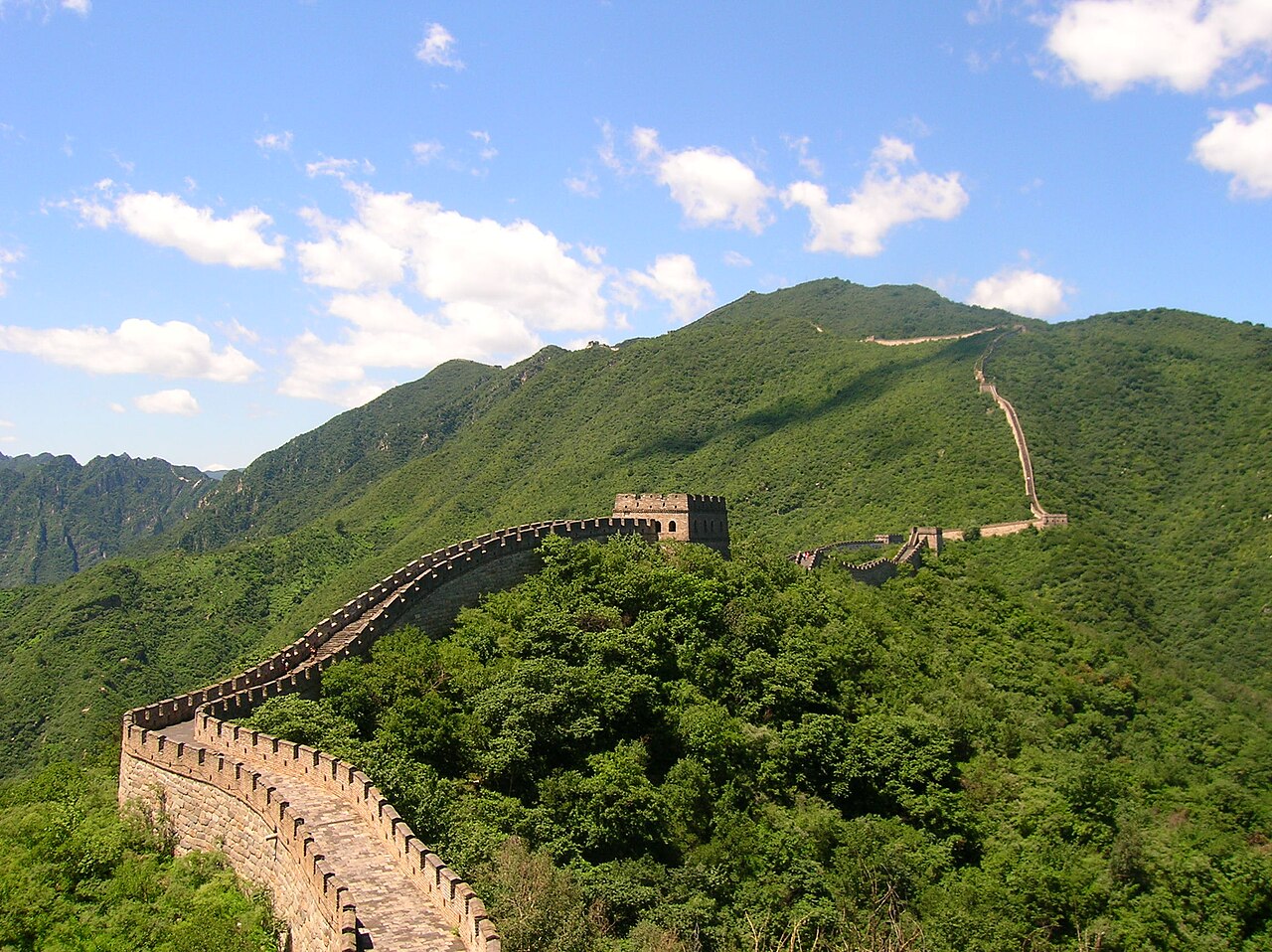 Mutianyu Great Wall watchtowers along lush green mountain ridges in Beijing