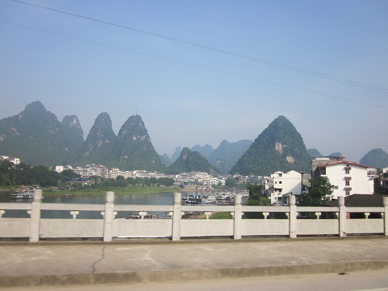 Emerald Li River winding between dramatic limestone karst peaks between Guilin and Yangshuo